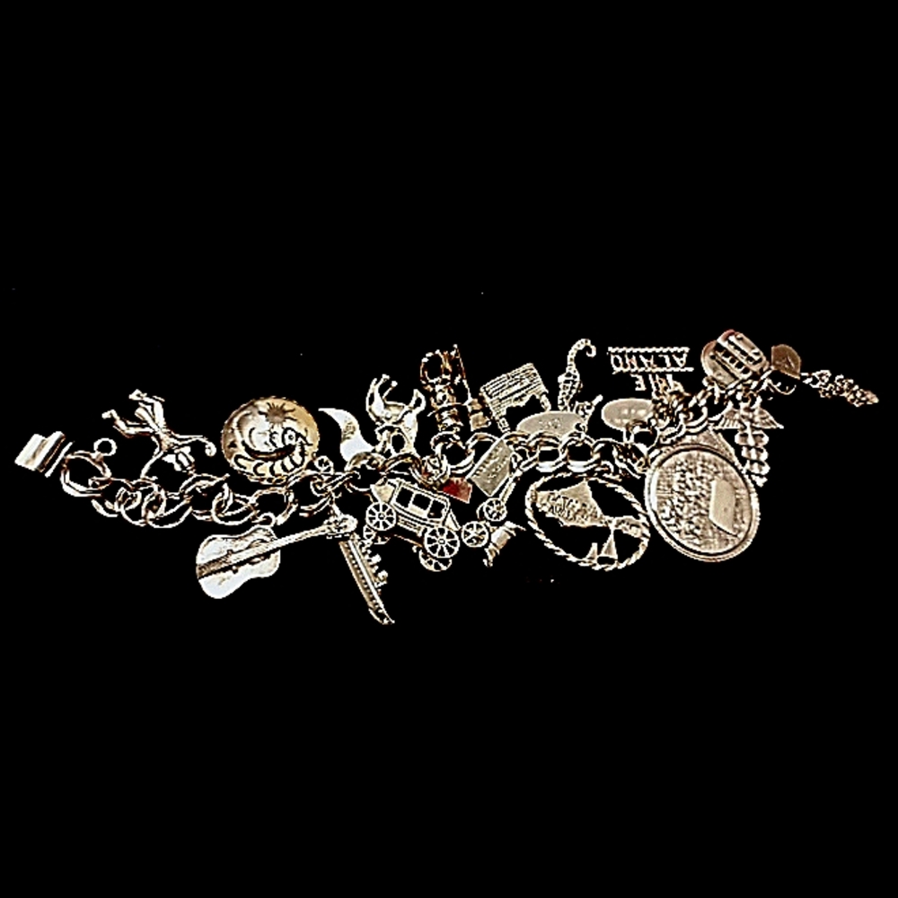 Jacoby-bender sterling silver antique charm bracelet.